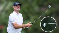 Justin Rose strikes an iron shot