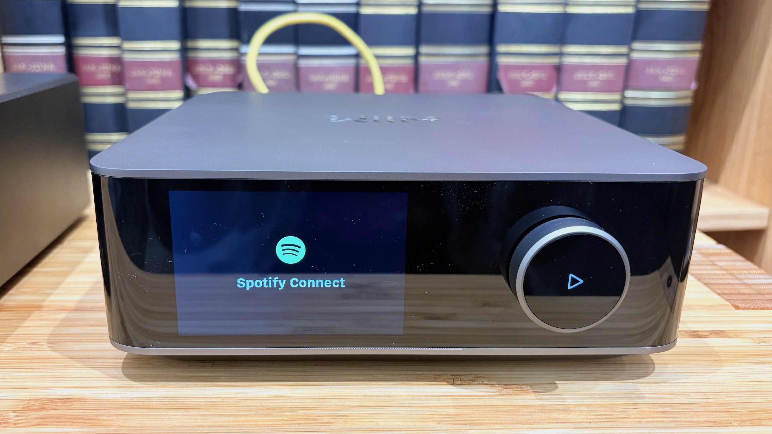 A WiiM streamer with the Spotify Connect logo on screen.