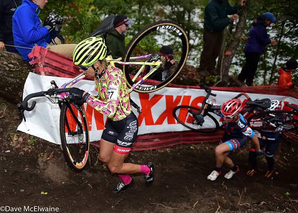 Emily Kachorek (Squid Bikes) running with her bike on lap two