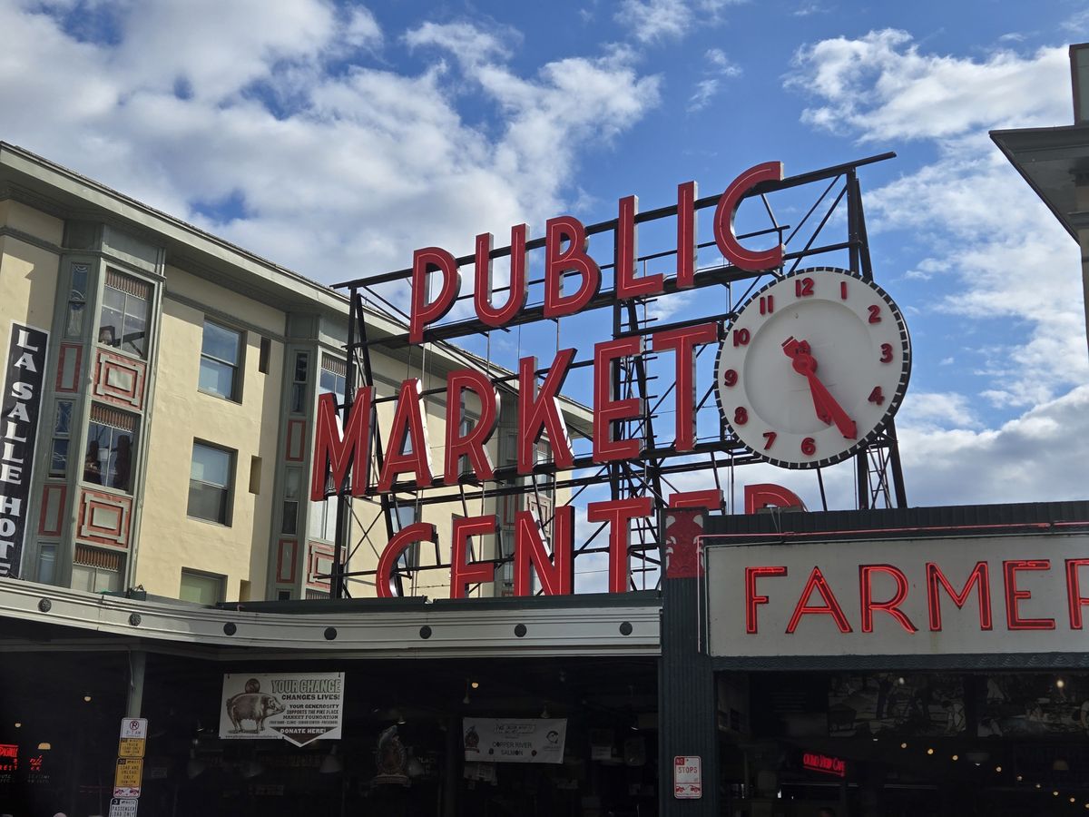 A red Public Market Center sign