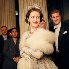 Claire Foy as Queen Elizabeth on The Crown wearing a tiara and fur stole