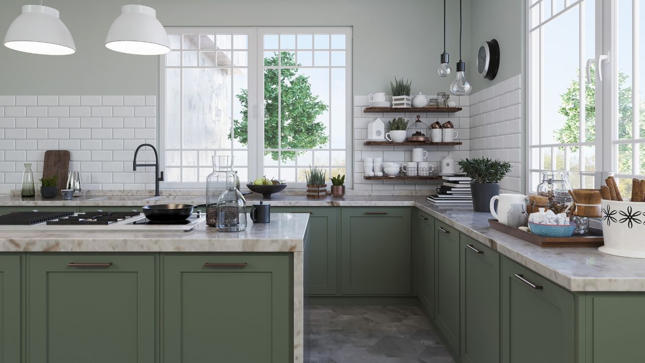 Large green kitchen with white subway tiles on the wall and dark wooden open shelving with white nested bowls mugs and crockery