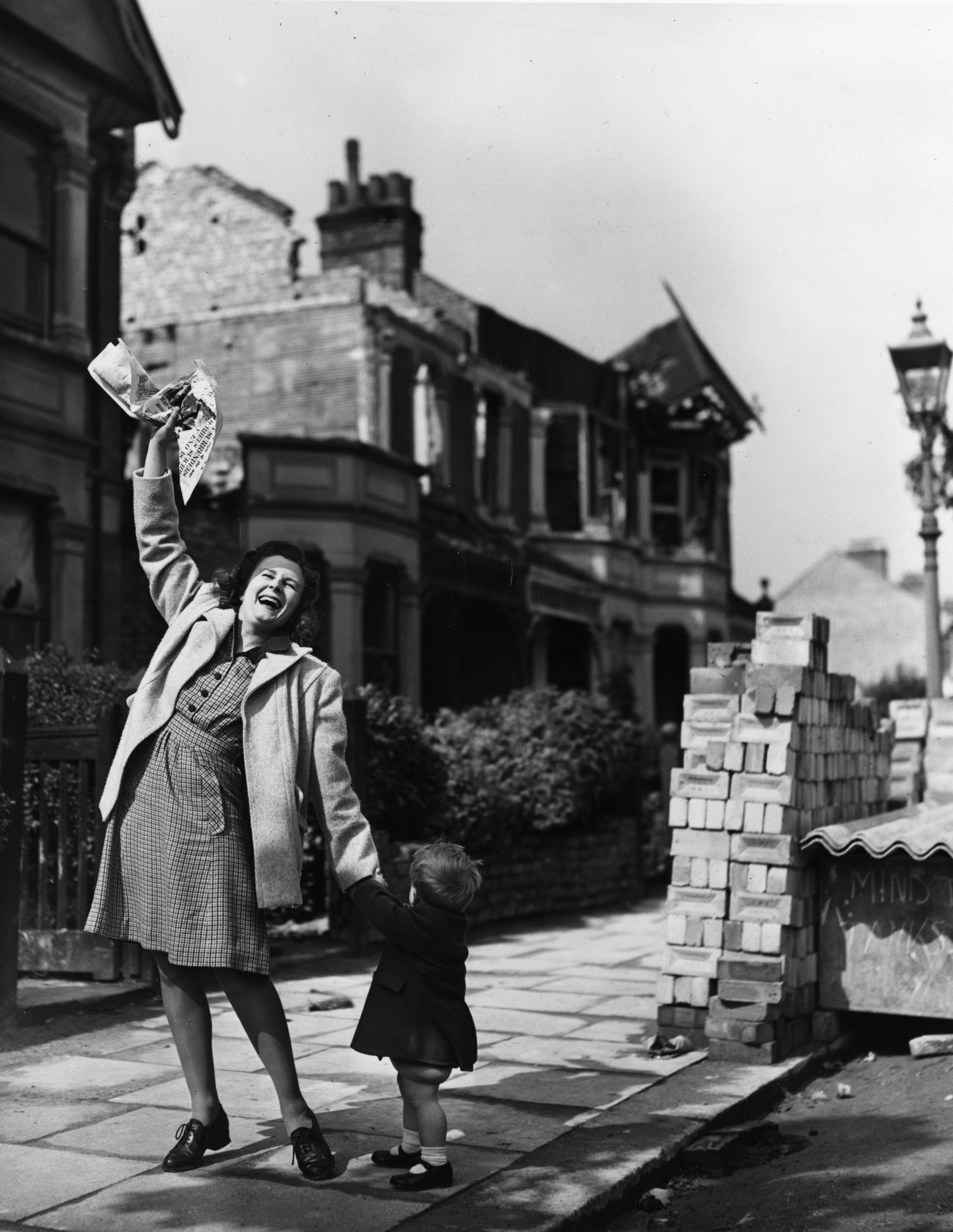 Mrs Pat Burgess of Palmer's Green, north London is thrilled to get the news that her husband will soon be home for good from Germany, 7th May 1945