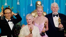 Gwyneth Paltrow, Judi Dench, Roberto Benigni and James Coburn at the 1999 Academy Awards 