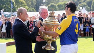 (L-R) Peter Moore, Global Prestige Brand Director of Royal Salute, Prince Philip, Duke of Edinburgh and Fred Mannix attend the Royal Salute Coronation Cup at Guards Polo Club on July 23, 2016 in Egham, England