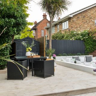 sunken garden makeover with black painted fences