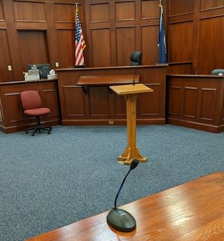 A Electro-Voice mic and loudspeaker power audio in a court.