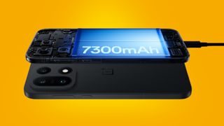 The OnePlus 15 on an orange background