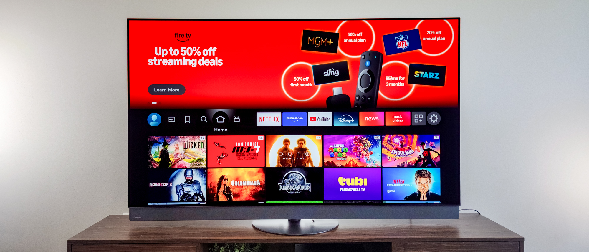 A Panasonic Z95B OLED TV on a side table.