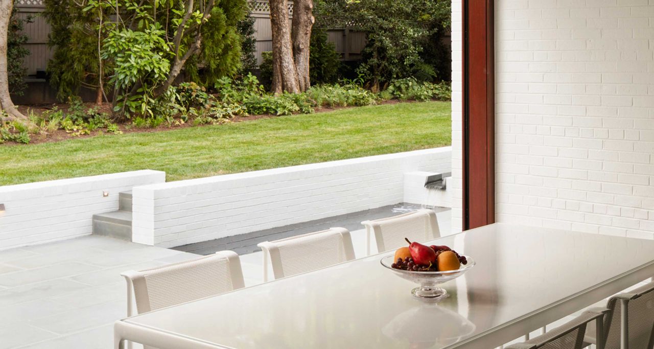 a dining room looking out onto a lawn