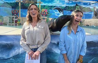 Kate Monahan (l.) and Megan Hayes hang out with a seal on WFLX's ‘South Florida Daily.’