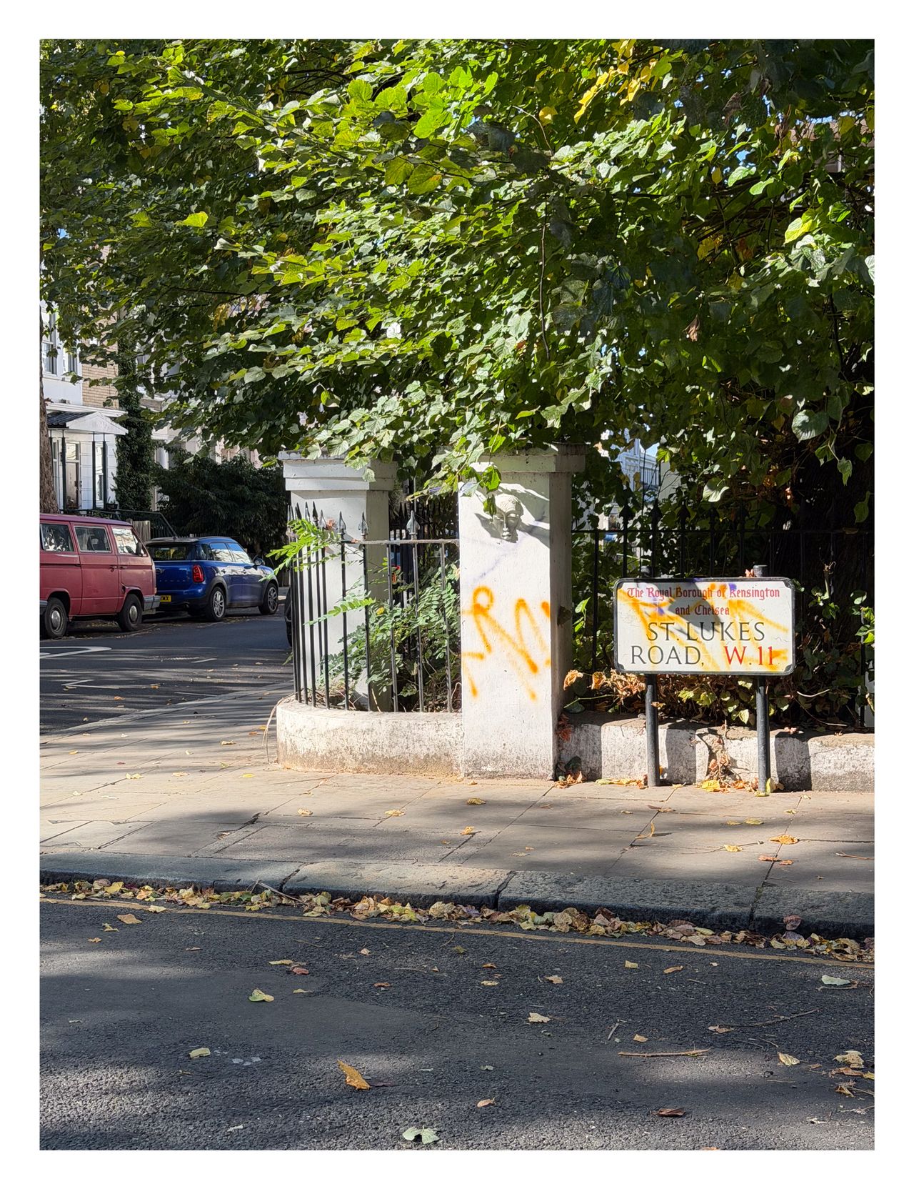 A street sign covered in graffiti in London