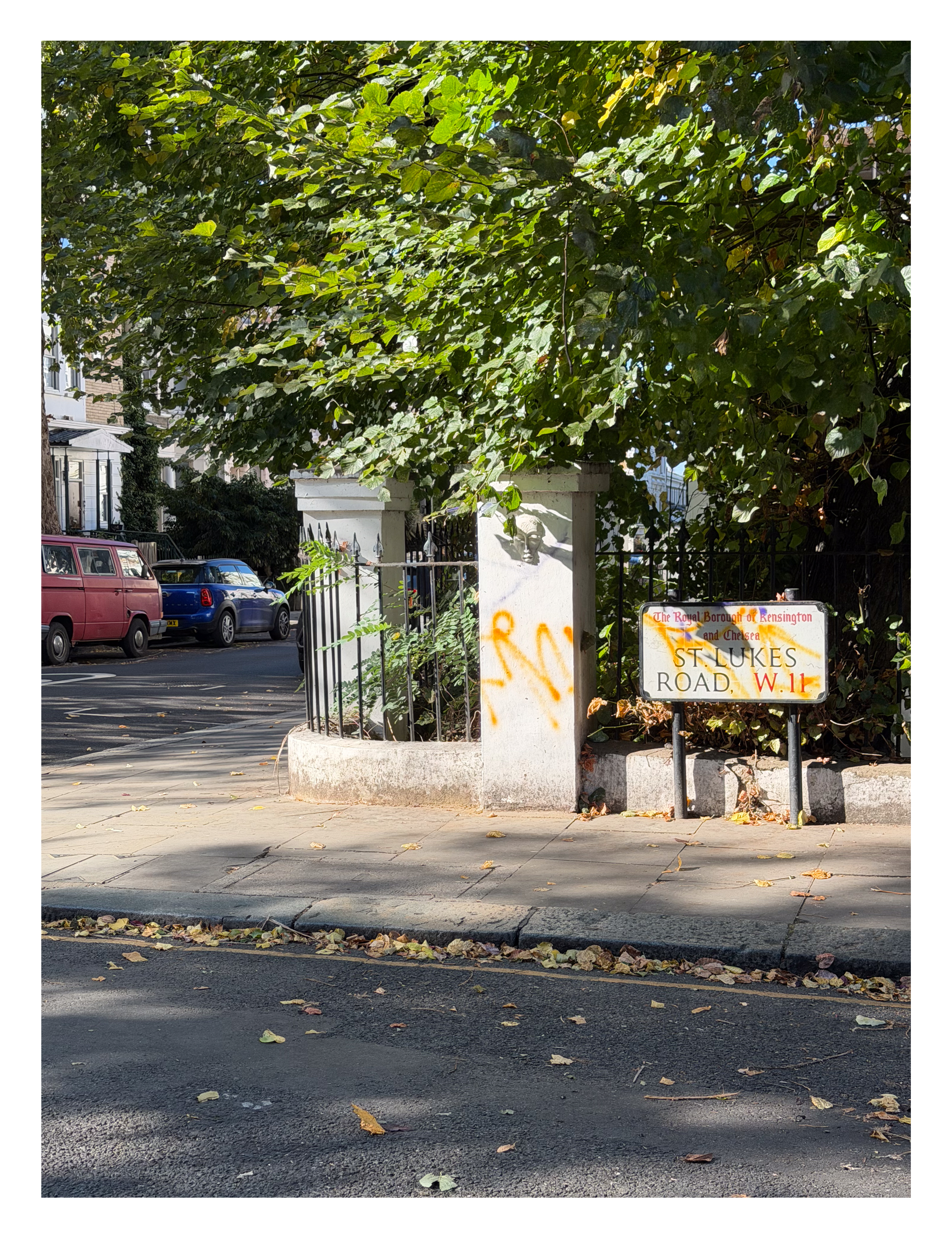 A street sign covered in graffiti in London