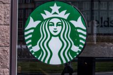Starbucks logo on window of Amsterdam location