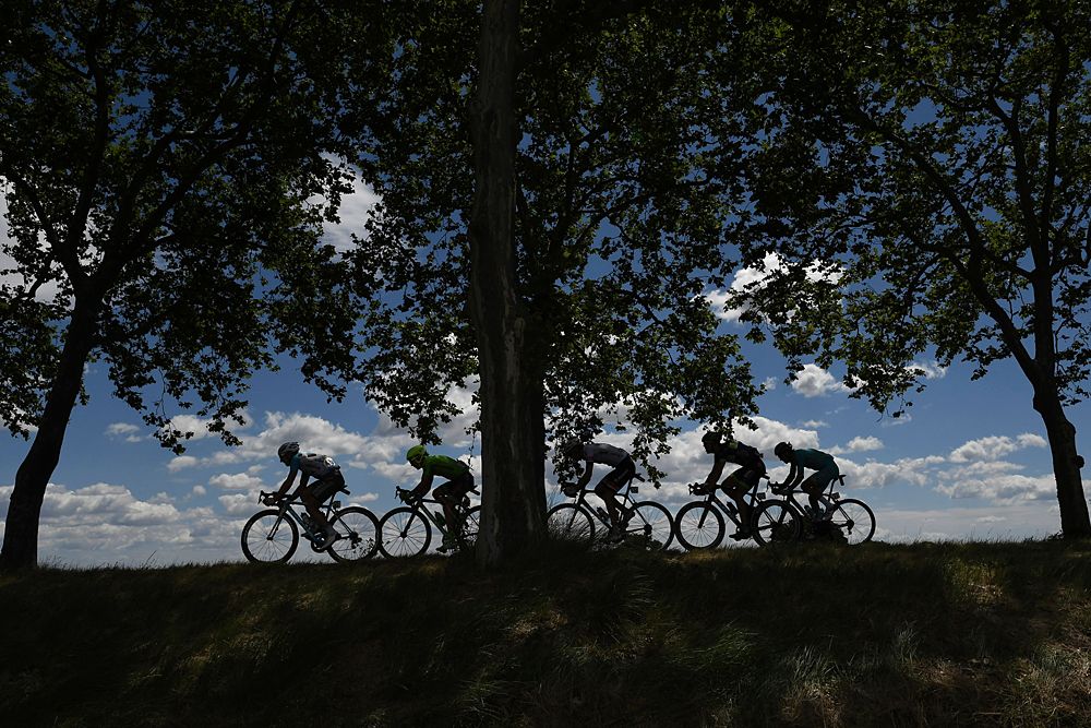 Cyclists ride in a breakaway during the 178 km twelvelth stage of the 103rd edition of the Tour de France