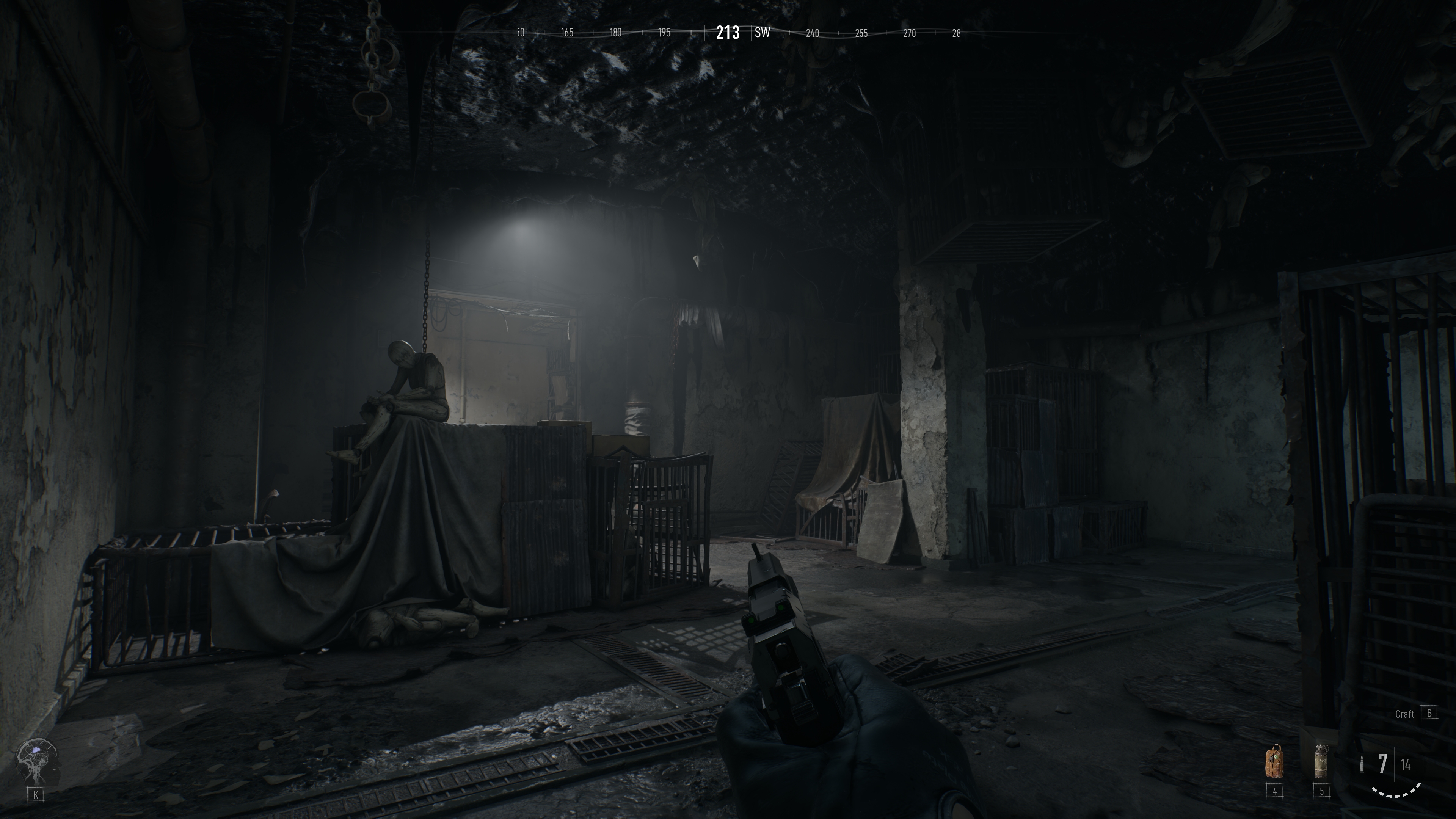 Project Spectrum screenshot showing the player moving through a dark room while holding a pistol, with a creepy mannequin sat on a box