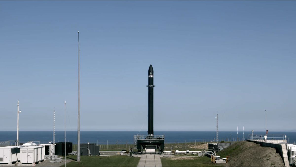 A Rocket Lab Electron booster stands atop its launch pad on the Mahia Peninsula in New Zealand for the company's return-to-flight launch set for Aug. 31, 2020 NZT.