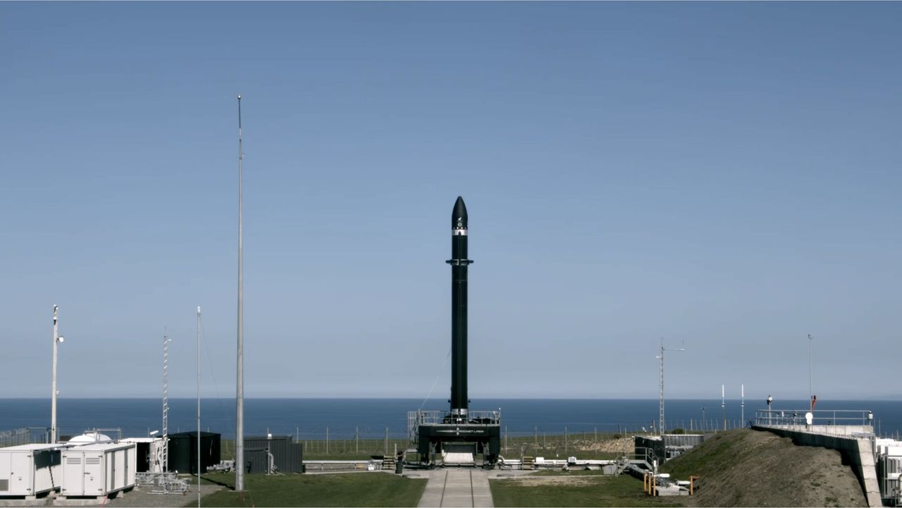 A Rocket Lab Electron booster stands atop its launch pad on the Mahia Peninsula in New Zealand for the company's return-to-flight launch set for Aug. 31, 2020 NZT.