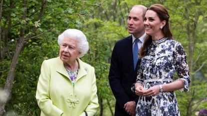 Britain's Catherine, Duchess of Cambridge (R) shows Britain's Queen Elizabeth II (L) and Britain's Prince William, Duke of Cambridge, around the 'Back to Nature Garden' garden, that she designed along with Andree Davies and Adam White, during their visit to the 2019 RHS Chelsea Flower Show in London
