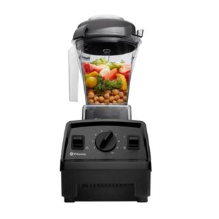 A black Vitamix mixer with chickpeas and peppers in the clear jug