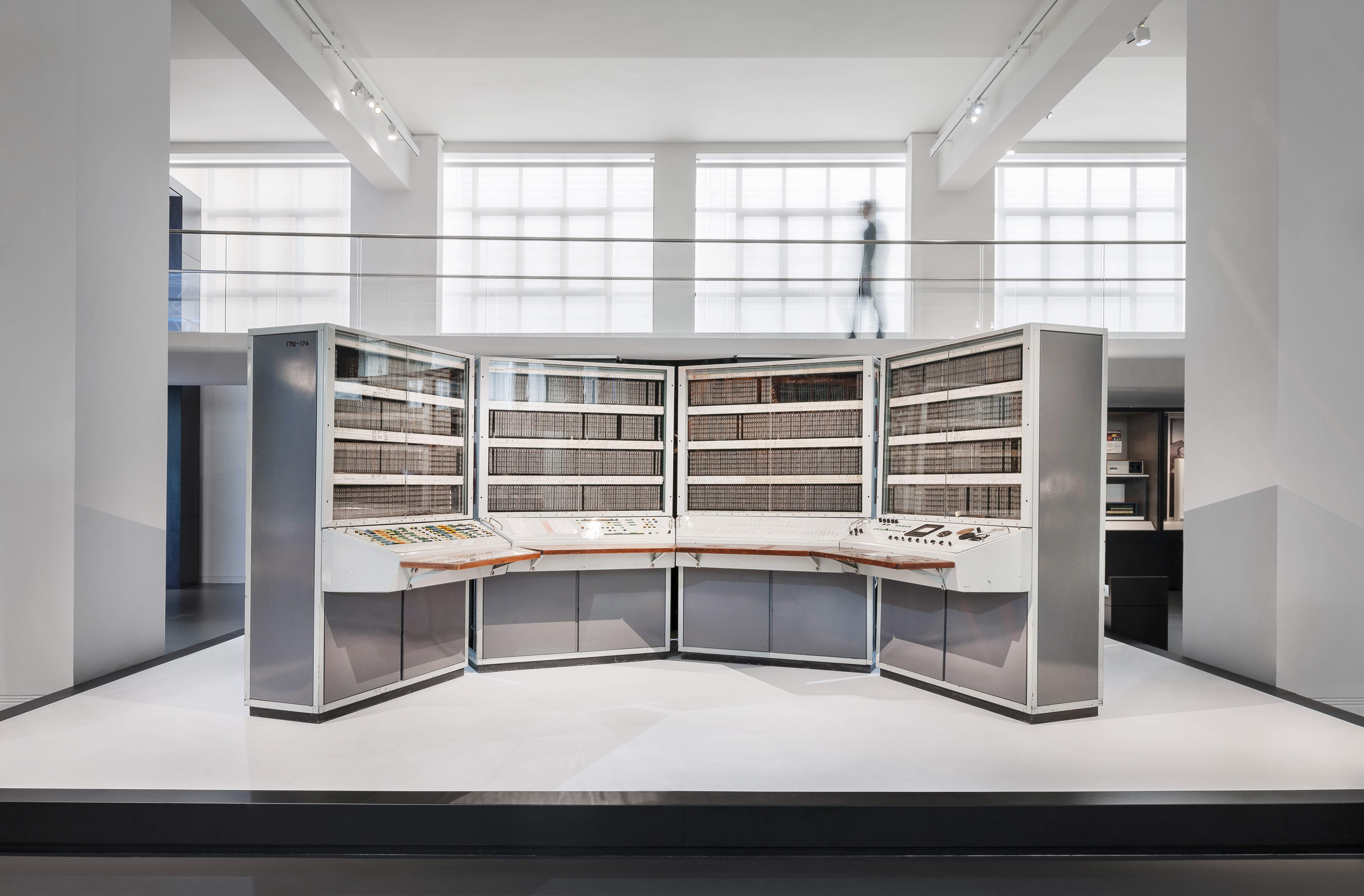 Display stand in white museum interior