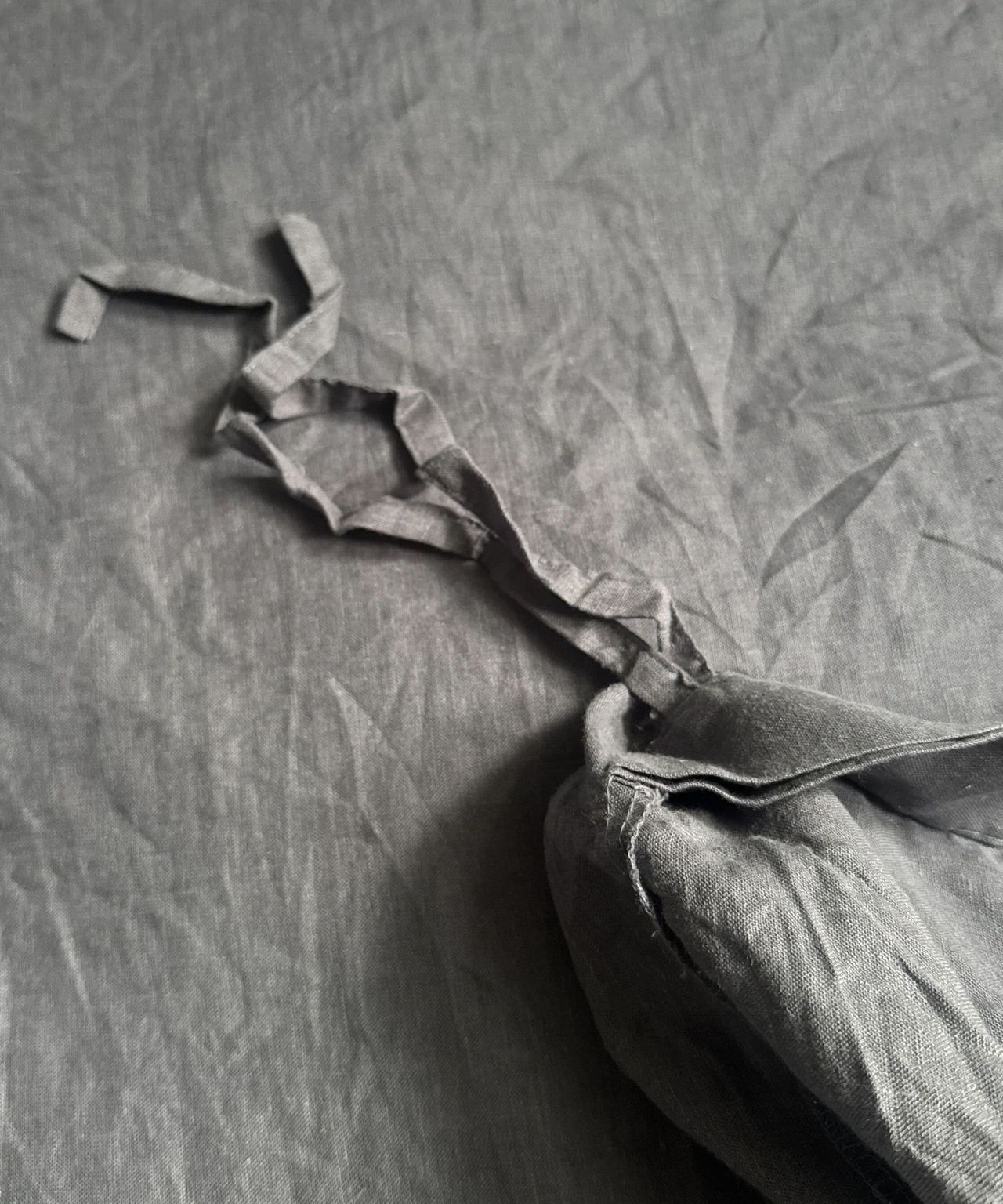 close up details of Pottery Barn's linen bedding
