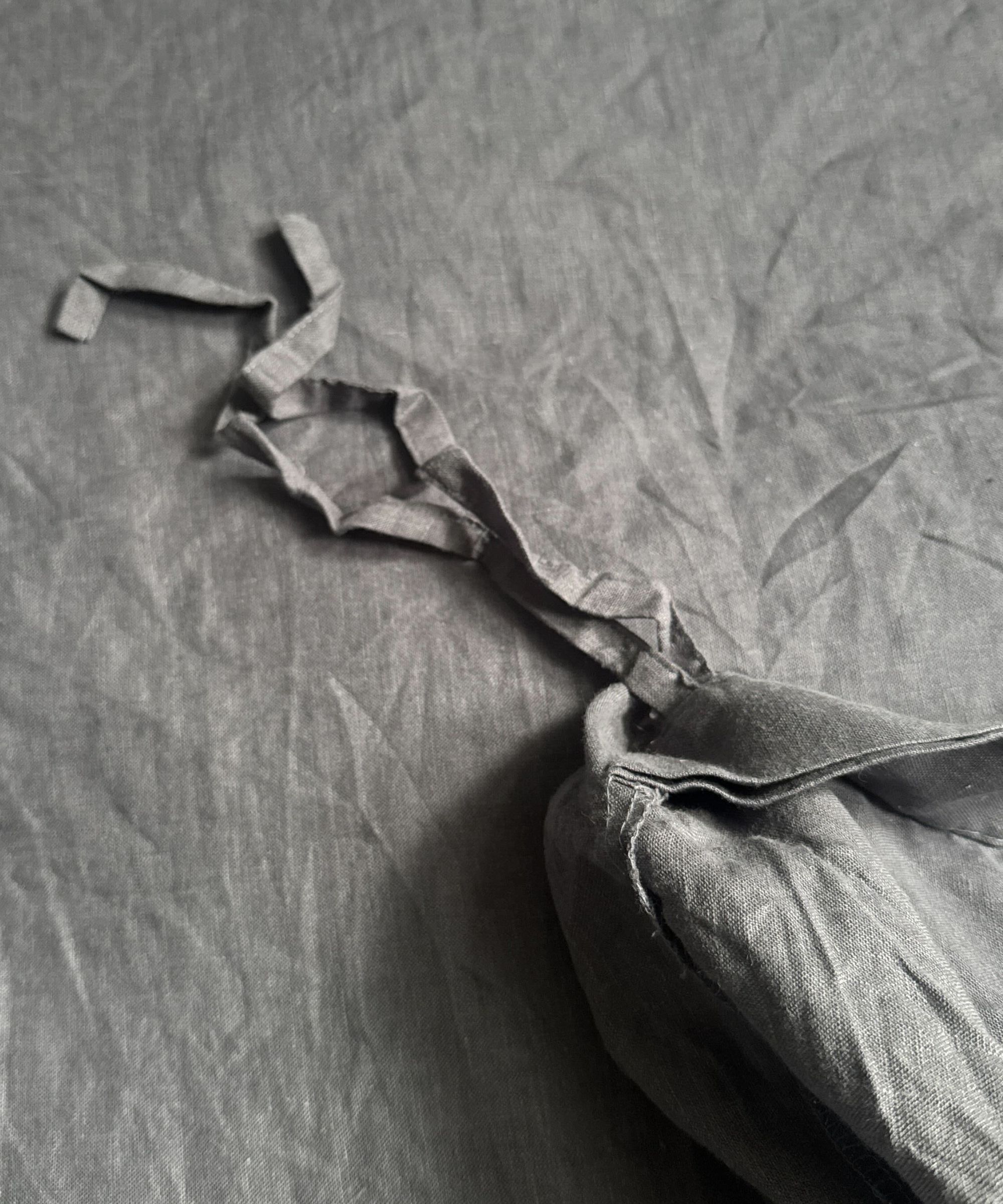 close up details of Pottery Barn's linen bedding