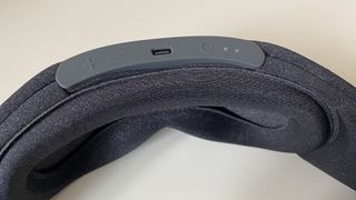 The buttons at the top of the Aura smart sleep mask