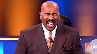 Steve Harvey laughs as he hosts Family Feud.