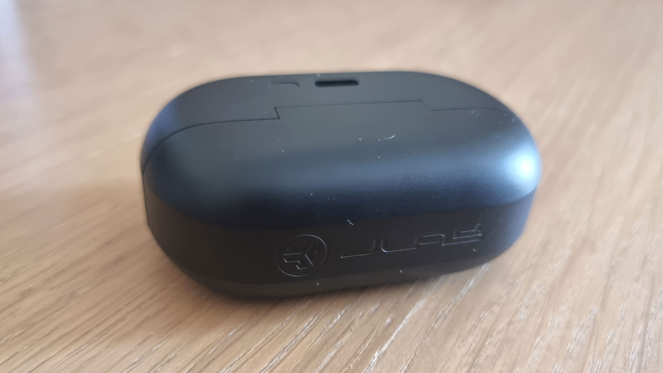 JLab Flex Earbuds in the closed carrying case
