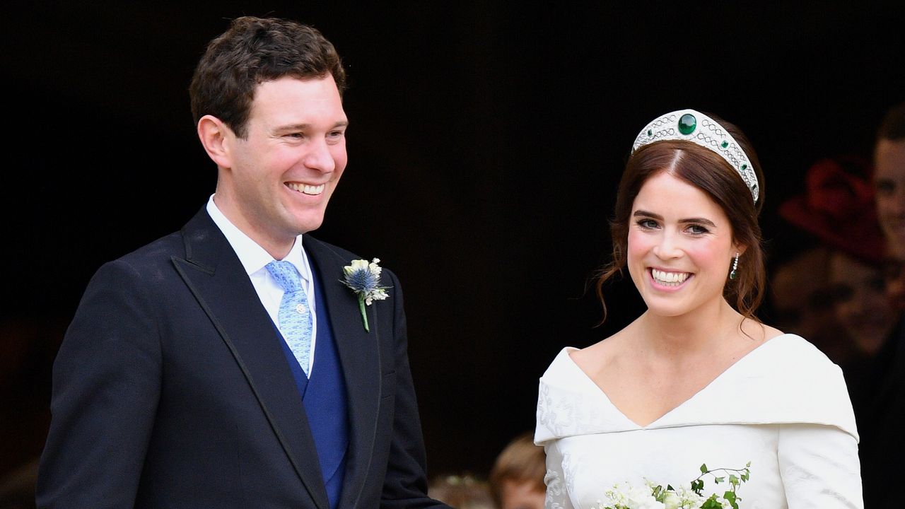 Jack Brooksbank and Princess Eugenie leave St George&#039;s Chapel after their wedding ceremony on October 12, 2018 in Windsor, England