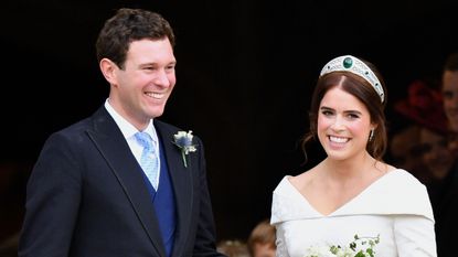 Jack Brooksbank and Princess Eugenie leave St George's Chapel after their wedding ceremony on October 12, 2018 in Windsor, England