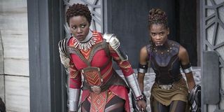 Lupita Nyong'o as Nakia in Dora Milaje costume and Letitia Wright as Shuri in full costume in Black