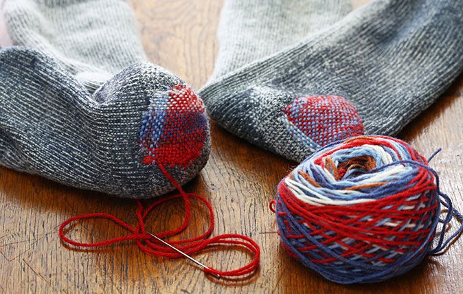 darning socks, repairing holes in socks