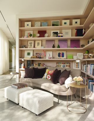 A living room with a corner shelf