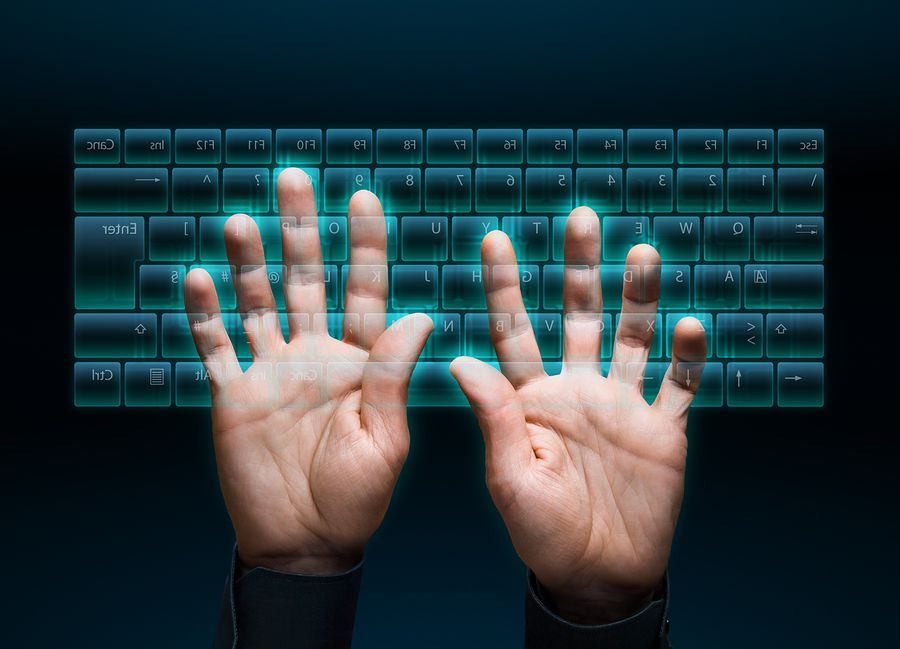 Hands typing on virtual keyboard