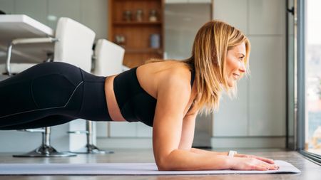 middle aged woman doing a plank