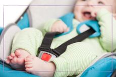How long can a baby be in a car seat illustrated by baby in green romper suit in car seat