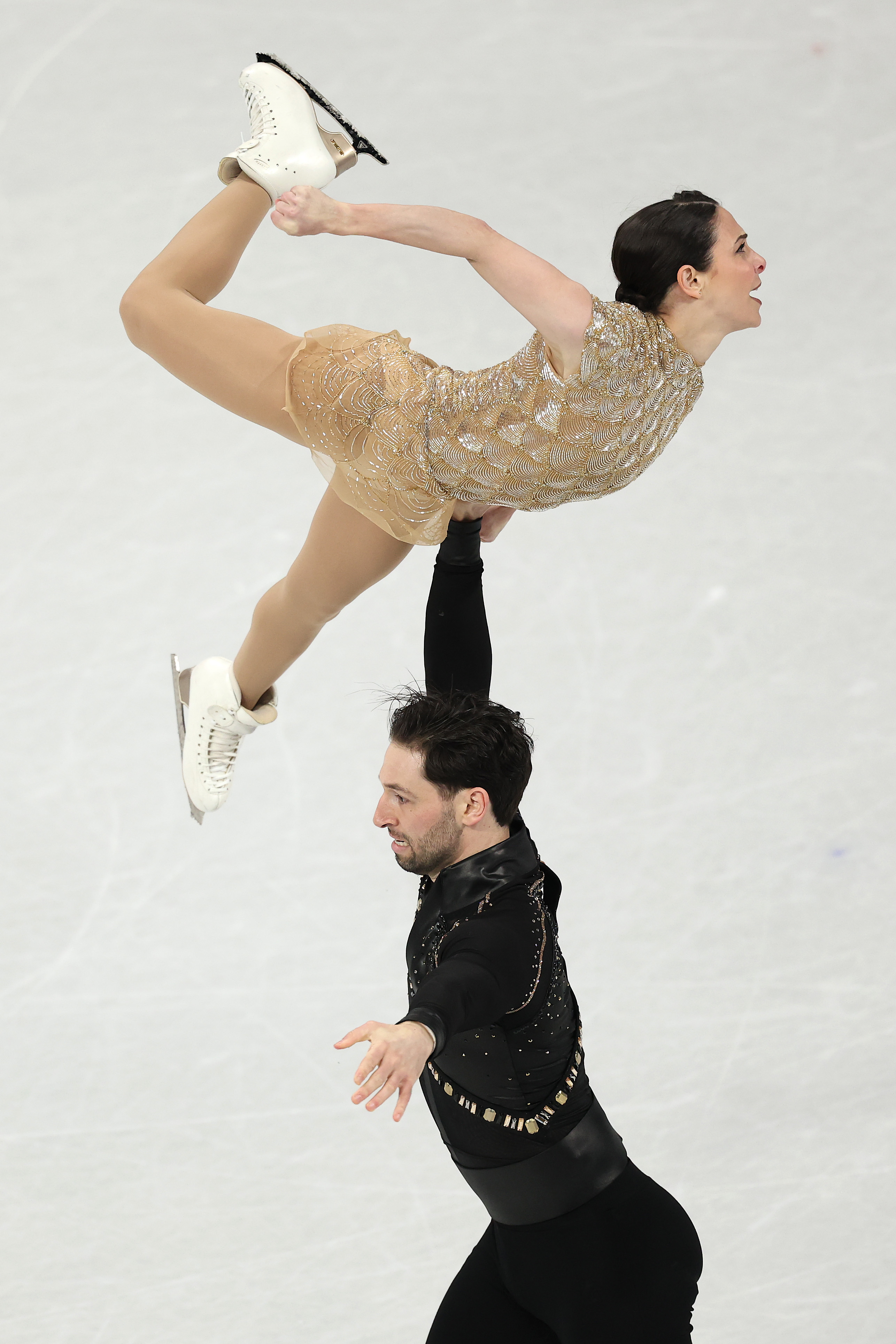 MILAN, ITALY - FEBRUARY 15: Deanna Stellato-Dudek and partner Maxime Deschamps of Team Canada compete in Pair Skating - Short Program on day nine of the Milano Cortina 2026 Winter Olympic games at Milano Ice Skating Arena on February 15, 2026 in Milan, Italy.