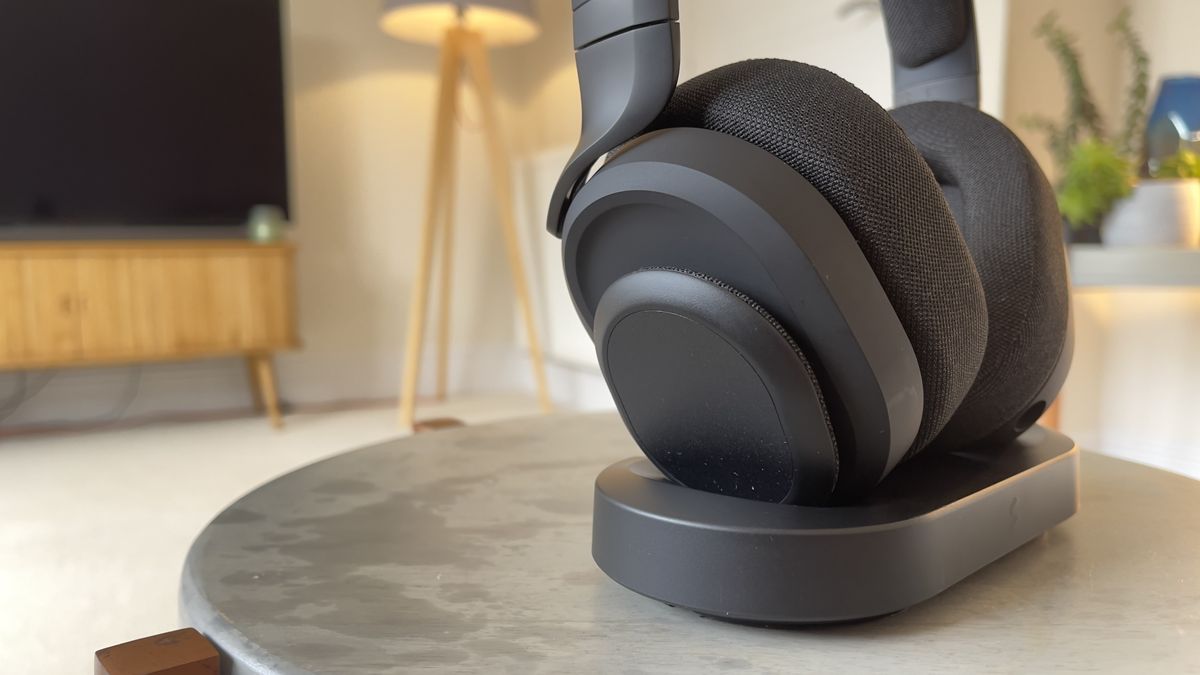 Fractal Scape wireless headset sat on a table in its charging dock.