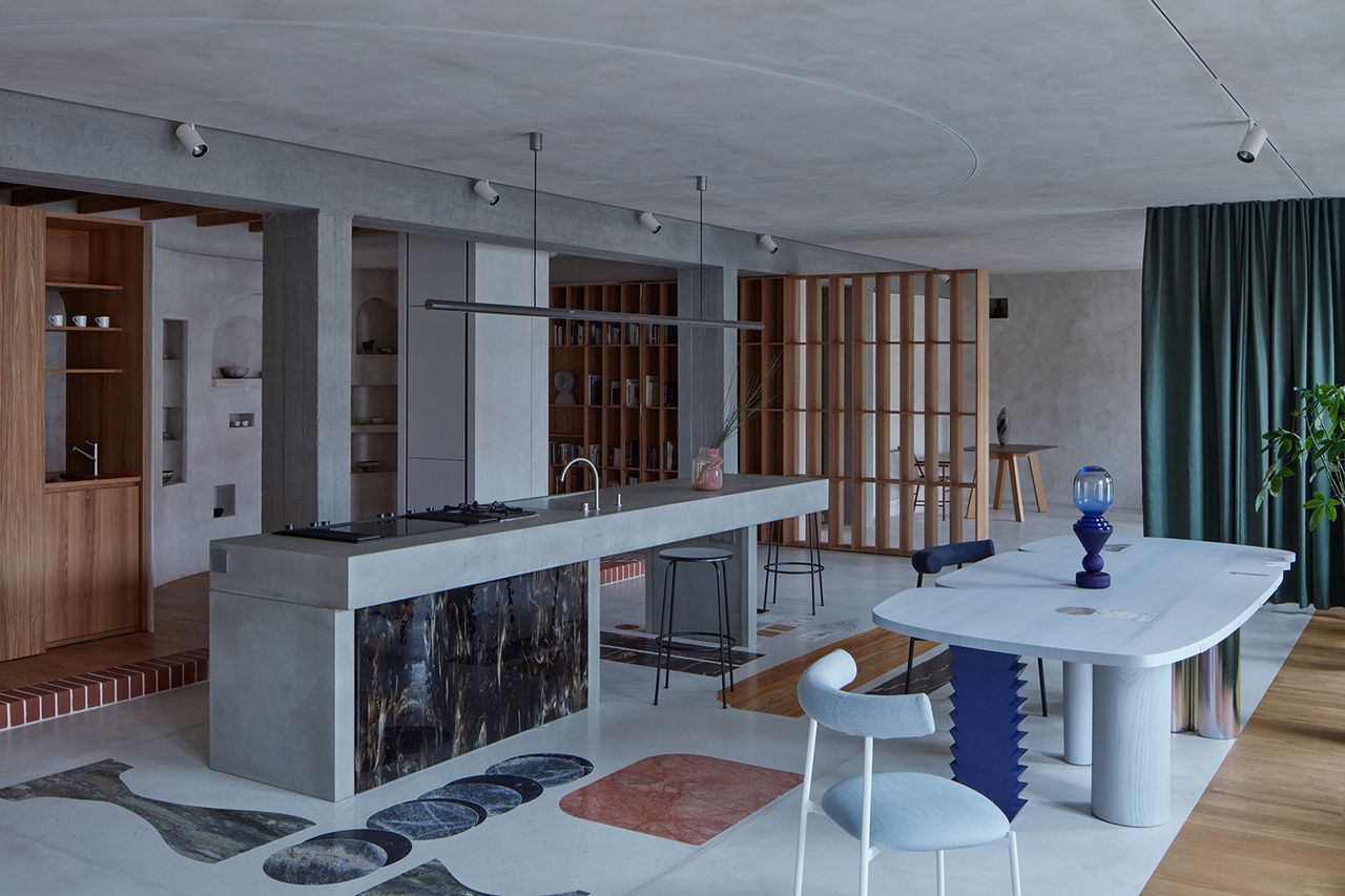 open plan kitchen with a curtain dividing the living area