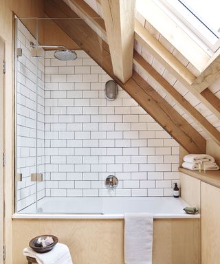 bathroom with pale wood and white tiles