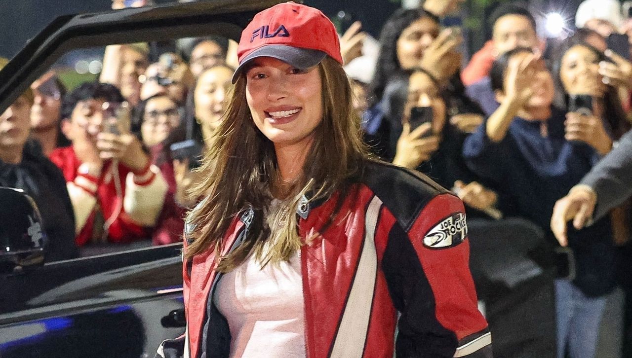 Hailey Bieber leaves a Billie Eilish concert wearing a red and black biker jacket crop top and biker shorts