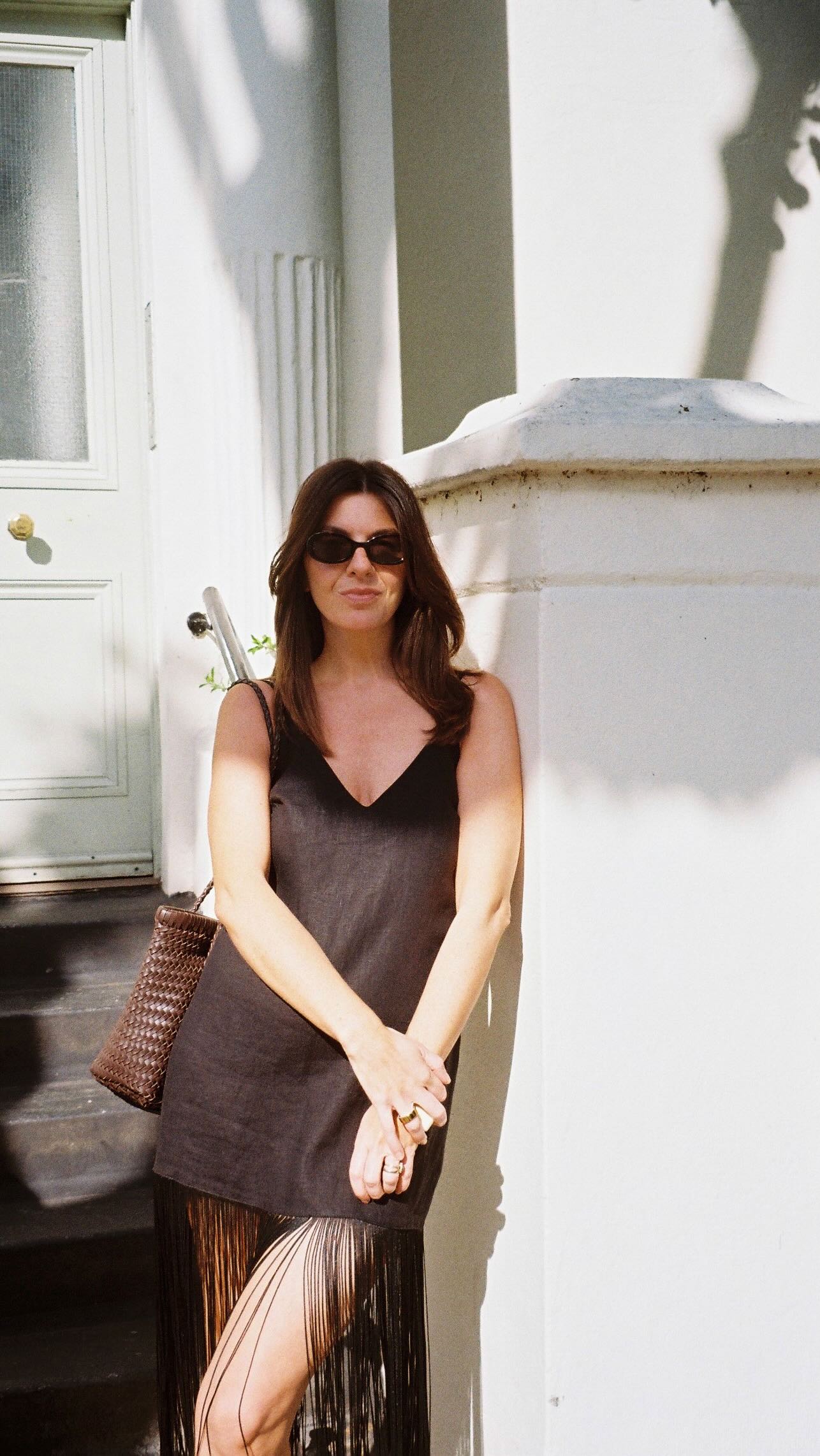 An image of @francescasaffari wearing a brown fringe wedding guest dress.