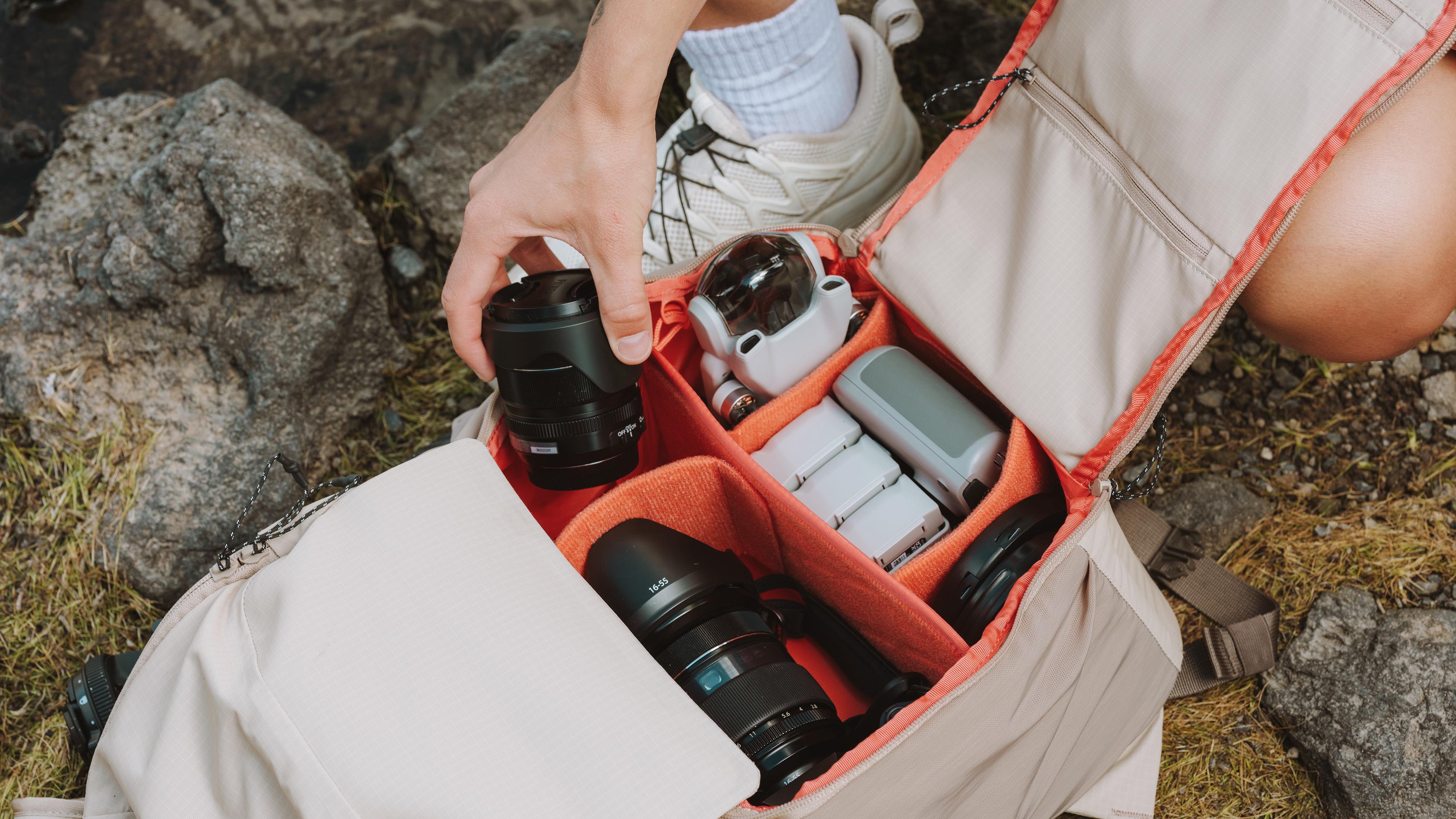 The Moment Sequence backpack being used by a photographer