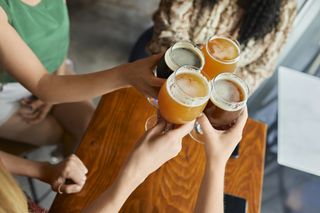 Going sober: a group of friends have a drink in a pub
