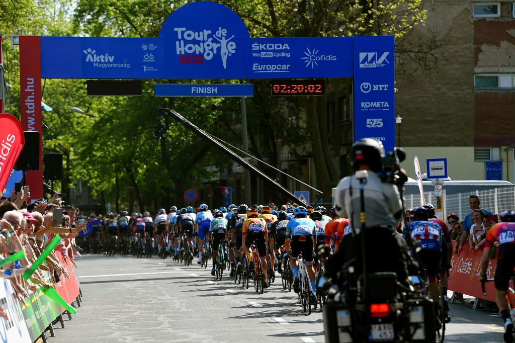 KAZINCBARCIKA HUNGARY MAY 14 A general view of the peloton competing cross the finishing line during the 43rd Tour de Hongrie 2022 Stage 4 a 177km stage from Kazincbarcika to Kazincbarcika tourdehongrie on May 14 2022 in Kazincbarcika Hungary Photo by Dario BelingheriGetty Images