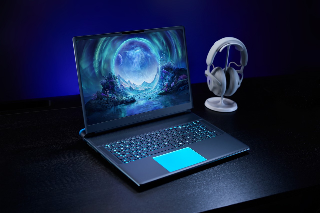 Alienware Area 51 laptop with a headset next to it