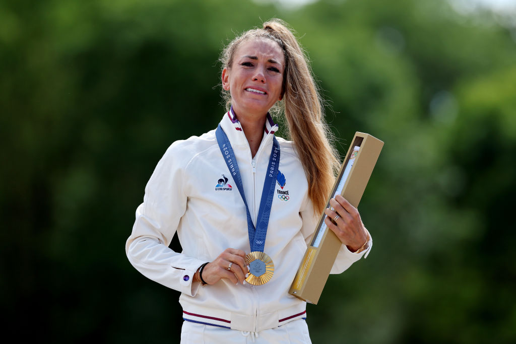 ELANCOURT FRANCE JULY 28 Gold medalist Pauline Ferrand Prevot of Team France poses on the podium during the Womens CrossCountry Cycling Mountain Bike Gold Medal race on day two of the Olympic Games Paris 2024 at Elancourt Hill on July 28 2024 in Elancourt France Photo by Tim de WaeleGetty Images