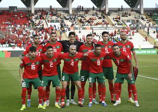 Morocco AFCON 2023 squad: Players of the Morocco pose for a team photo ahead of the Africa Cup of Nations (CAN) 2024 Group F football match between Morocco and Tanzania at Stade Laurent Pokou in San Pedro, Ivory Coast on January 17, 2024. (Photo by Stringer/Anadolu via Getty Images)